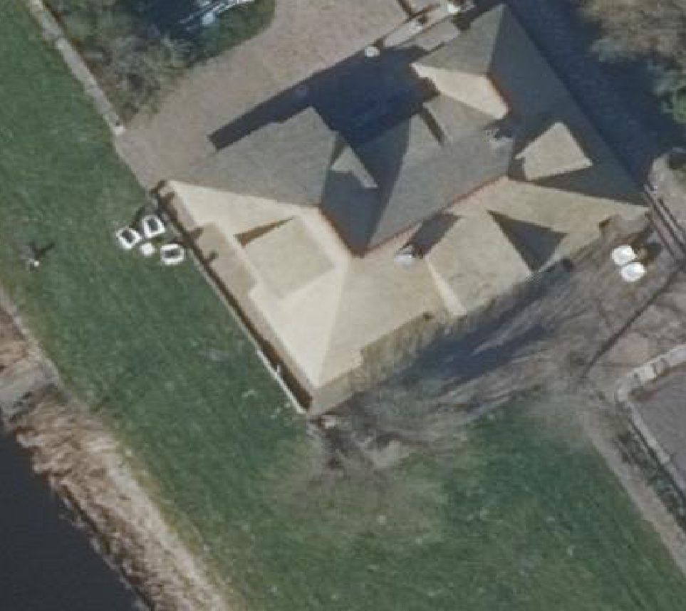 True ortho luchtfoto van Warmenhuizen met zicht op woning