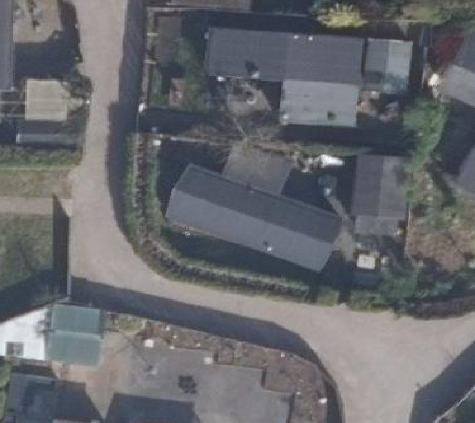 True ortho luchtfoto van Putten met zicht op woning
